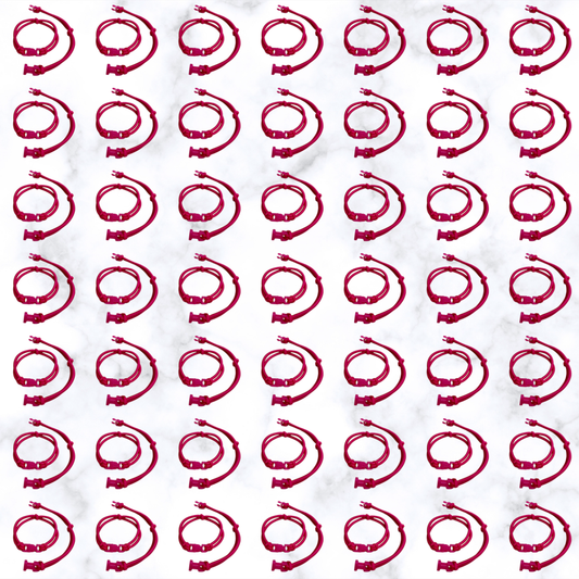 Grid of Hot Pink Buckle Hair Tie elastics on marble, 100 pack for cheer, volleyball, and Pink Out games